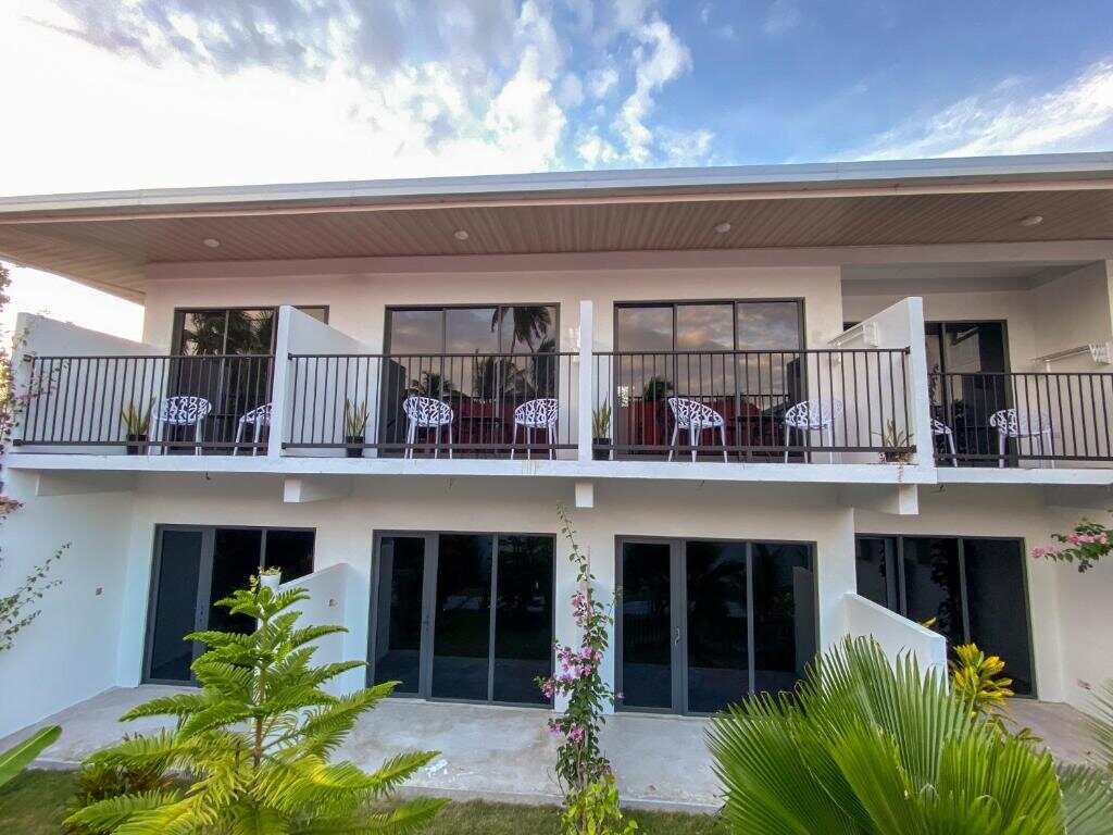 The white two-storey Chillax Thoddoo building with balconies